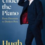 Playing Under the Piano book cover with actor Hugh Bonneville on cover