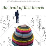 The Trail of Lost Hearts by Tracey Garvis Graves book clove with white snowy background with the back of a woman's head in a ski cap.